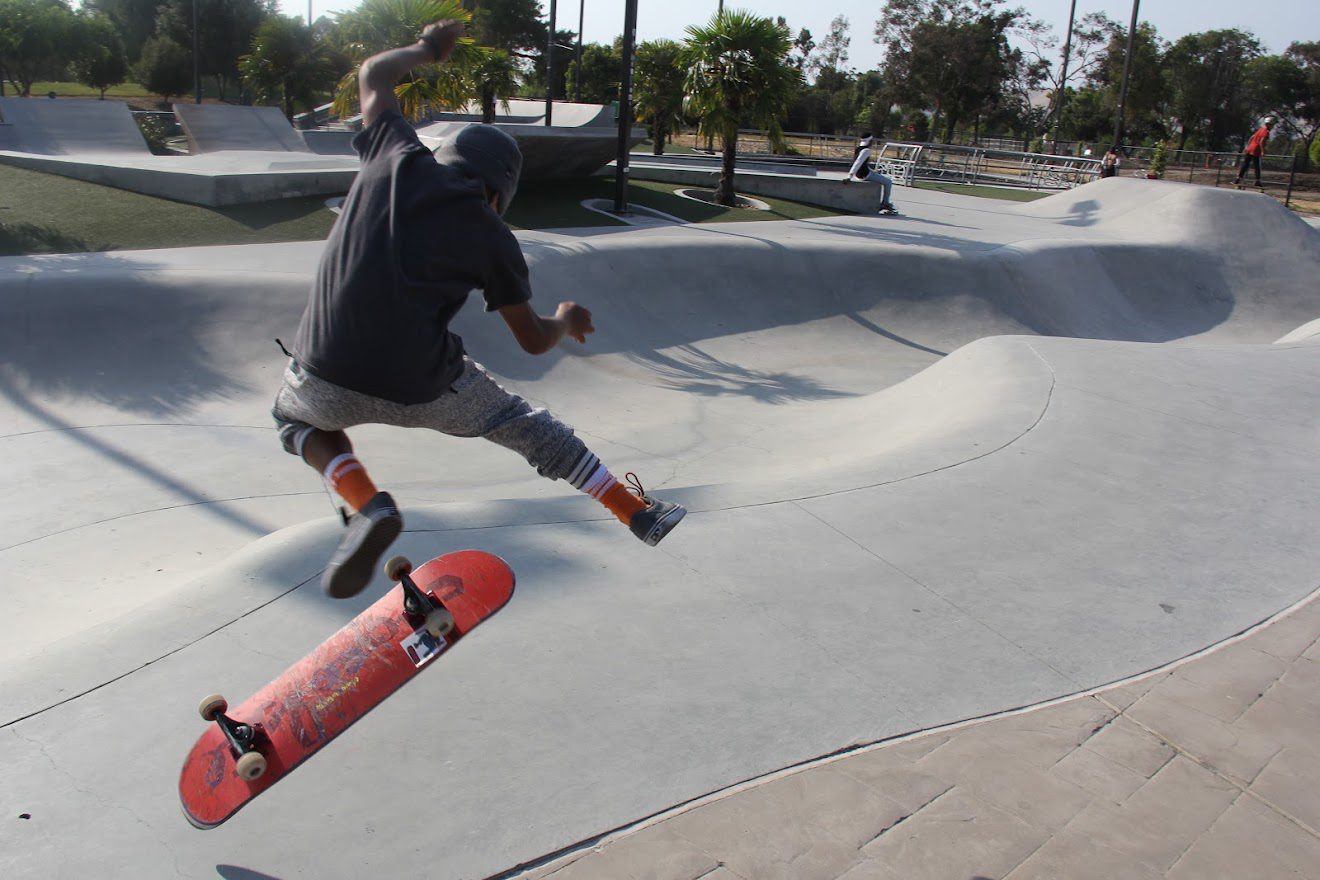 Man Playing Skateboard at Skatepark